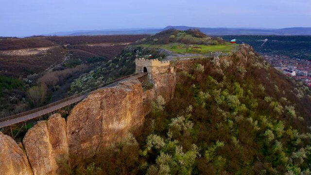 Adorable sunset on Ovech Fortress. Colorful spring cityscape of Provadia town, Bulgaria, Europe. 4k drone flight point of view (Ultra High Definition).