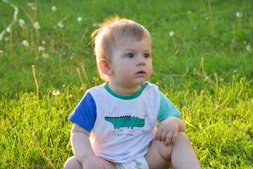 little child in the grass