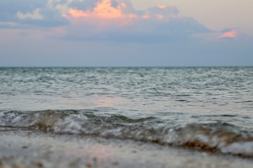 waves on the beach in the sunset