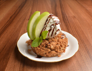 homemade baked apple crumble pie with vanilla ice cream and sliced of green apple fruit on wood table dessert halal menu