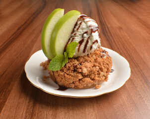 homemade baked apple crumble pie with vanilla ice cream and sliced of green apple fruit on wood table dessert halal menu