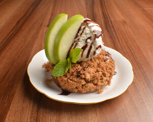 homemade baked apple crumble pie with vanilla ice cream and sliced of green apple fruit on wood table dessert halal menu
