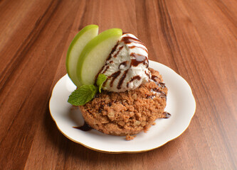 homemade baked apple crumble pie with vanilla ice cream and sliced of green apple fruit on wood table dessert halal menu