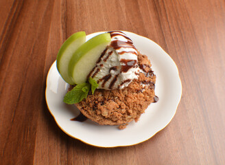 homemade baked apple crumble pie with vanilla ice cream and sliced of green apple fruit on wood table dessert halal menu
