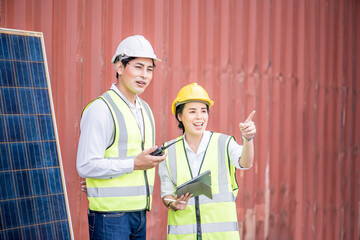 male engineer or manager and female worker Use of radio control Installing a Solar Cell ,on white background