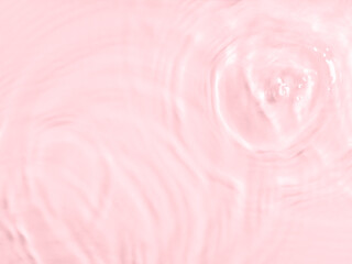 Pink water surface color background with ripples, circles and drops - 443033266