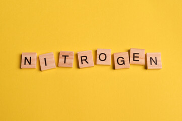 Square letters with text NITROGEN isolated on yellow background