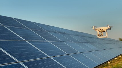 The drone monitors solar panels. The concept of the near future