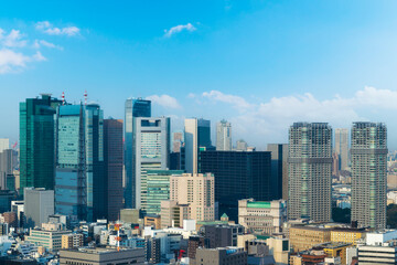 skyline of tokyo cityscape view with skyscraper, modern office building and blue sky background in Tokyo city, Japan.
