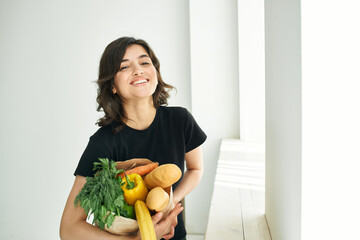 cheerful woman package with groceries homework healthy food