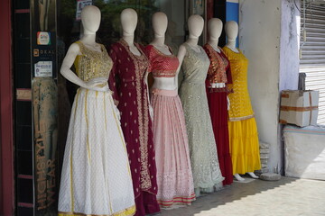 Mannequins dressed in latest fashion in front of retail clothes shop. Fashion and Retail Shopping...