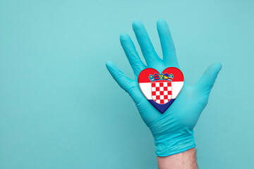 Croatia medical health heart. Nurse hand holding country heart flag
