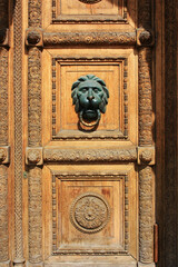 The door handle in the form of a lion`s head