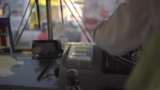 Bus driver driving a bus
