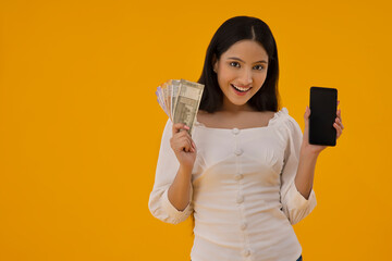 A young woman holding money and mobile in her hands.