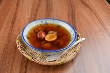 chilled cold sweet treasure herbal sweet soup dessert (Cheng teng) in bowl on wood table halal asian dessert menu