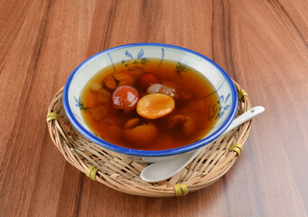 chilled cold sweet treasure herbal sweet soup dessert (Cheng teng) in bowl on wood table halal asian dessert menu