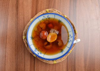 chilled cold sweet treasure herbal sweet soup dessert (Cheng teng) in bowl on wood table halal...