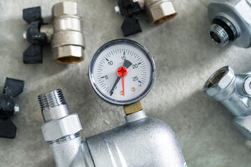Pressure gauge and plumbing fittings for piping installation. Close-up