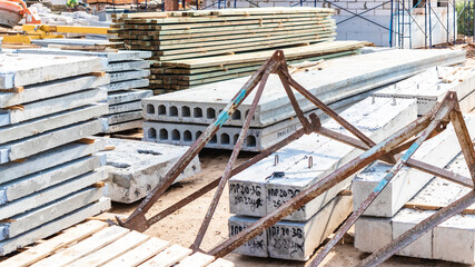 Reinforced concrete slabs and building materials at the construction site. Storage of materials for...