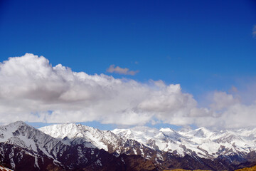 Fototapeta na wymiar Nature scene - Aerial view Peak of Snow Mountain of himalayan mountains with clouds blue sky at Leh Ladakh , Jammu and Kashmir , India 