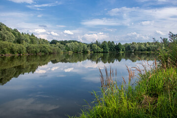 The calm surface of the lake on a summer day