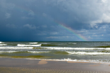Storm cloud and rainbow over the Baltic Sea