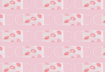 Pattern made with red lip print on white mask. Minimal concept background of pandemic love and social engagement.