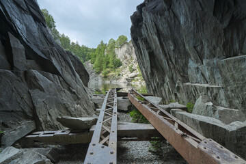 Looking out along Old iron girders left in an abandoned slate quarry in the Lake District