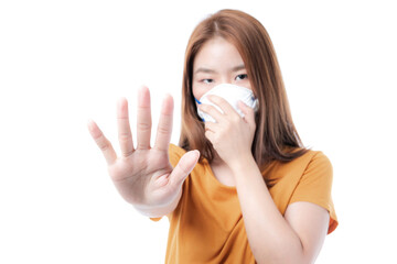 Asian girl wearing Face Mask show stop hands gesture for stop corona virus outbreak , protect spread Covid-19