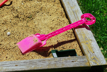 children's plastic toys in the sandbox