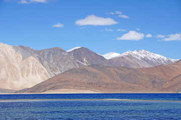 Landscape Nature Scene of Pangong tso or Pangong blue Lake with Himalaya Snow mountain background at Leh Ladakh ,Jammu and Kashmir , India  - unseen travel vacation park and outdoor