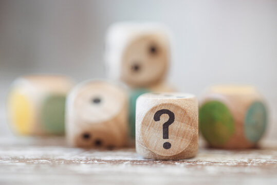 Close-up of wooden dice on a wooden table