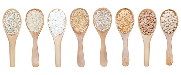 Collection of dry organic white and brown grain seed in wooden spoon isolated on white background....