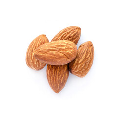 Group of roasted organic almond seed pile on white background