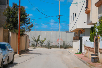 Fototapeta na wymiar The Israeli wall. between Israel and West Bank, Qalqilya. west bank, Palestinian Territories, Palestine, July 2, 2021