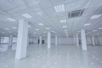 Spotlight and empty space. Empty office space in modern building. Interior of empty unfinished modern market. Architecture concept. Empty white room has white walls. Shopping center