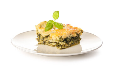 Plate with tasty green lasagna on white background