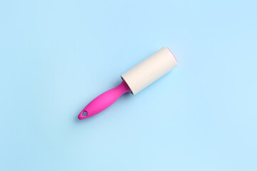 Lint roller on color background