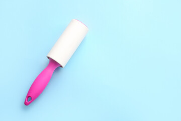 Lint roller on color background