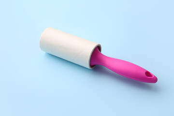 Lint roller on color background