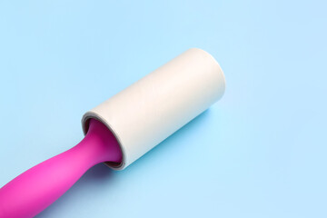 Lint roller on color background