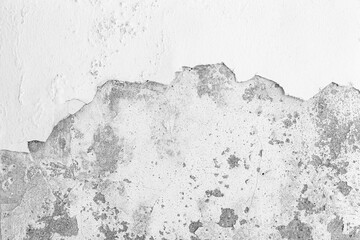 Old cement wall painted white, peeling paint texture and background