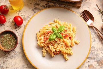 Plate with healthy pasta on grunge background