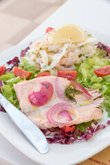 Seafood salad with salmon and vegetables