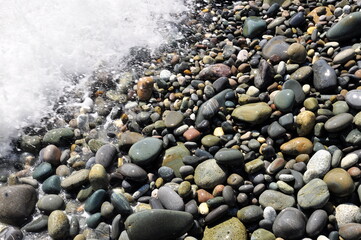 A wave breaking on the beach. Background image.