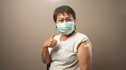 Happy senior woman after receive vaccine dose, Ideas for senior citizen getting fully vaccinated, No side effects from covid vaccine, Encourage Older Adults to getting vaccine, Vaccination at home - obrazy, fototapety, plakaty