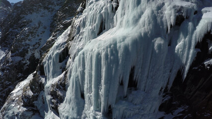 Caucasus, Ossetia. Midagrabin gorge. Frozen waterfalls on the slope of Mount Donchenta. 