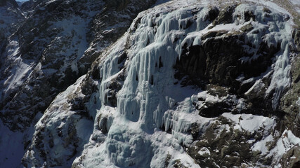 Fototapeta na wymiar Caucasus, Ossetia. Midagrabin gorge. Frozen waterfalls on the slope of Mount Donchenta. 