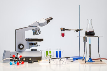 Science bench with microscope and chemicals